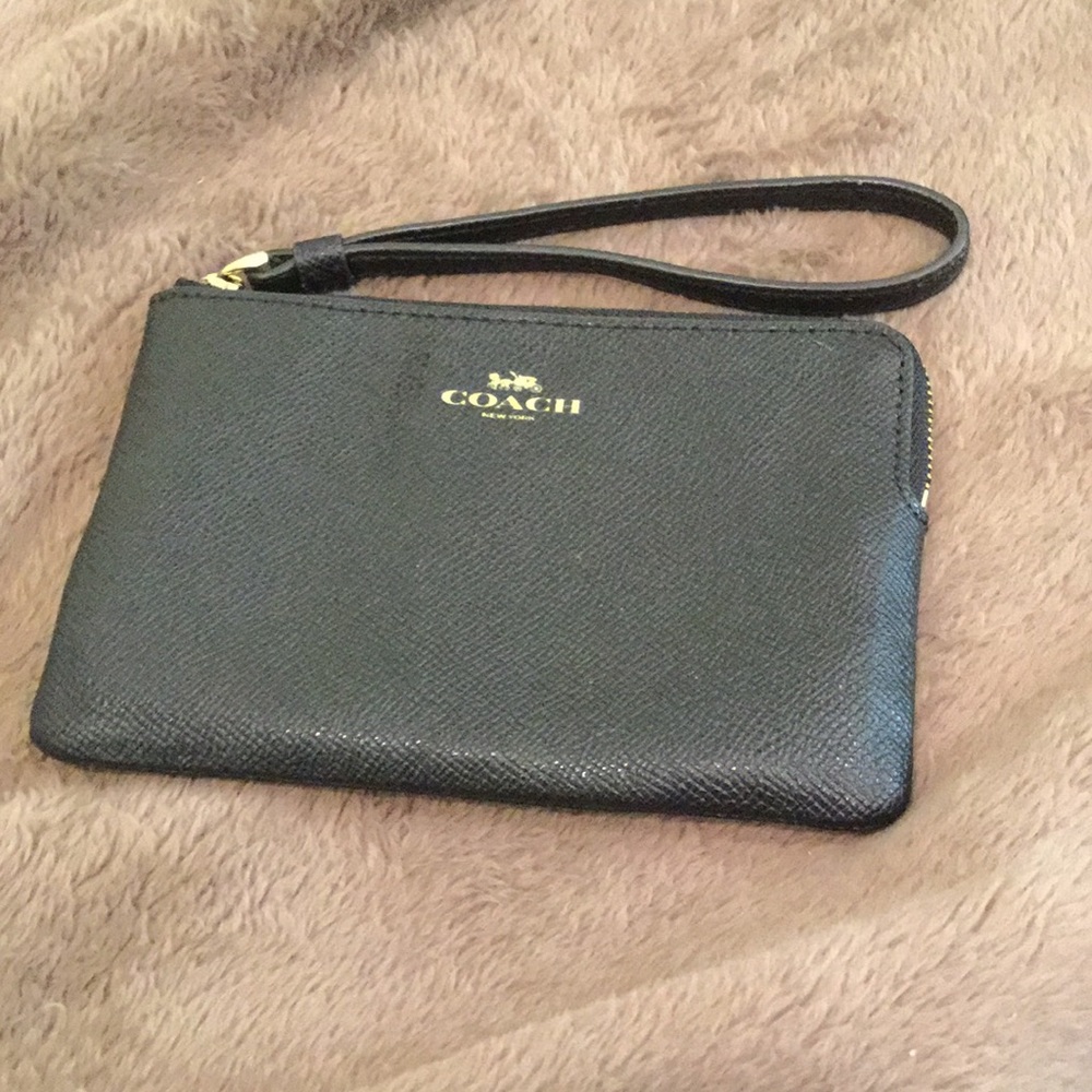Coach slitly used wristlet no defects